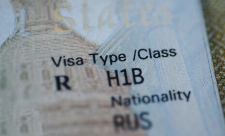 Partial image of H-1B visa stamp in passport - © Evgenia Parajanian / Adobe Stock